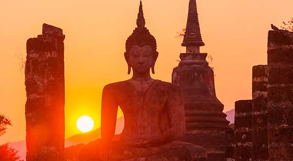 Buddha statue in sunset